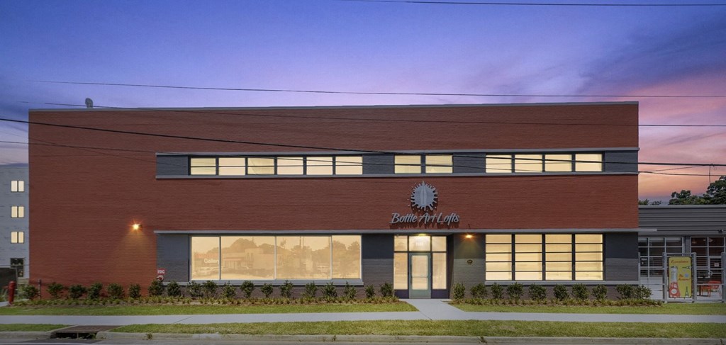 a view of the front of a building at dusk