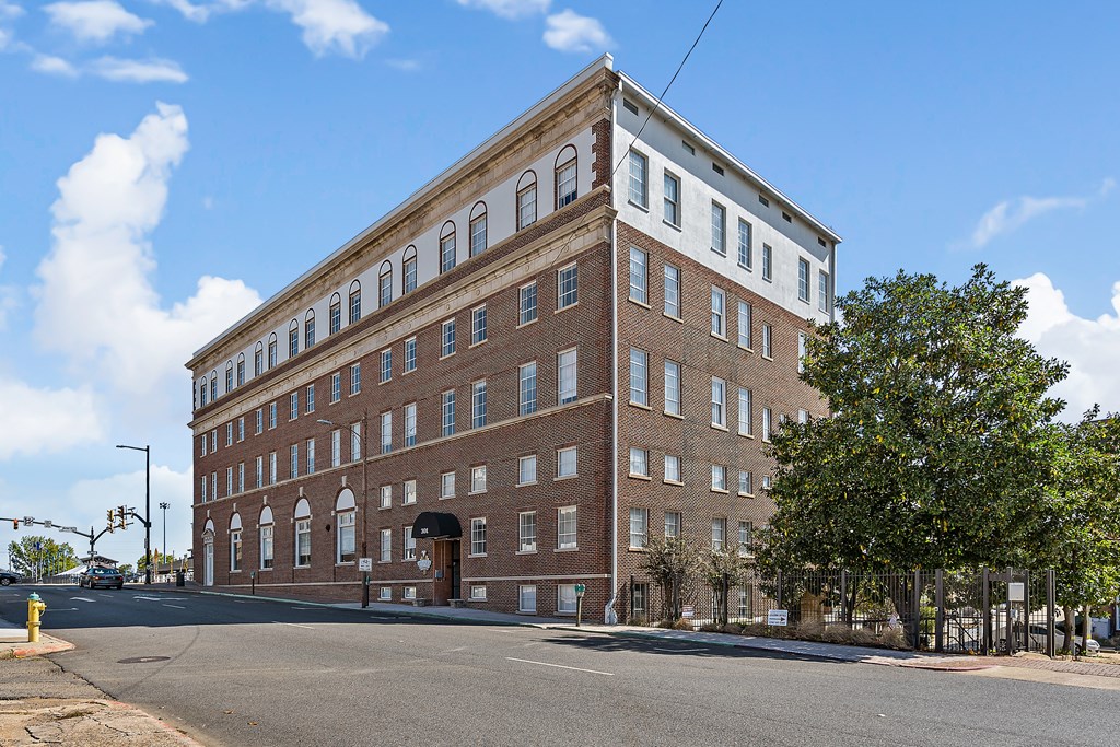 a brick building on the corner of a city street