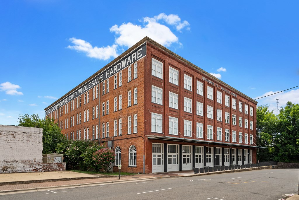 a large brick building on the side of a street