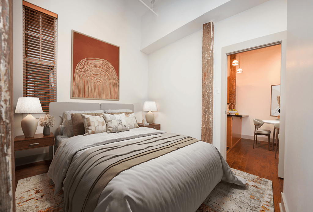 a bedroom with a bed and a door to a bathroom