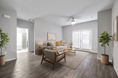 A living room with a brown chair and a brown rug.