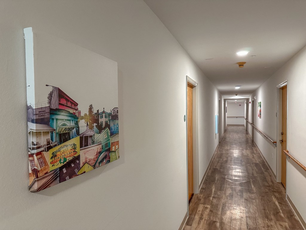 a painting on the wall of a hallway in a house