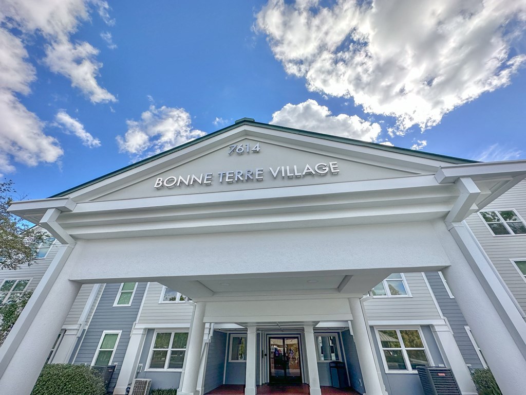 the front of the bonne terre village building with a blue sky background