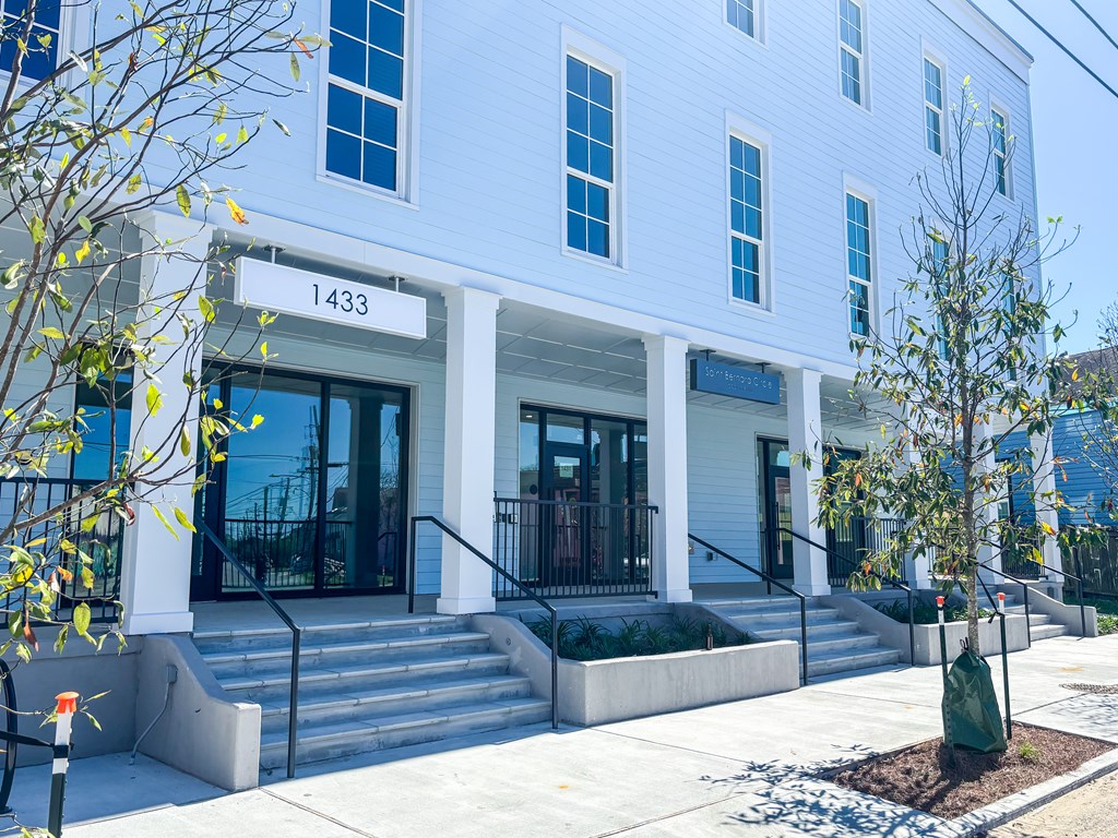 A white building with the number 1433 on the front.