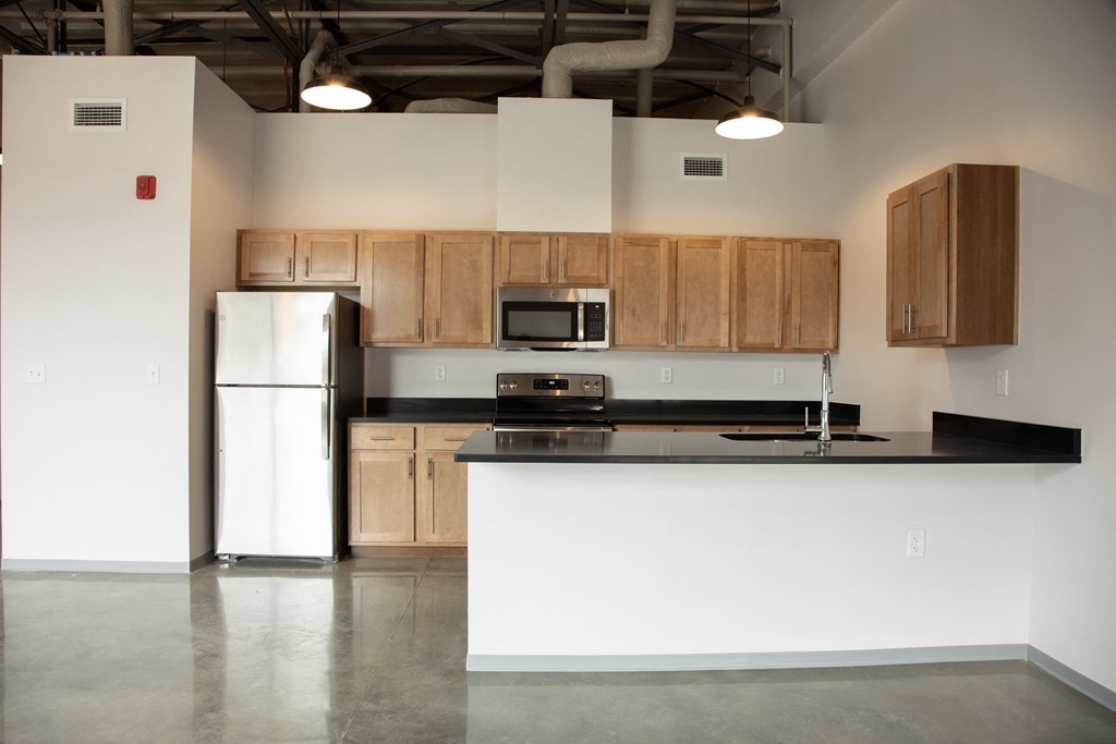 a kitchen with a counter top and a refrigerator