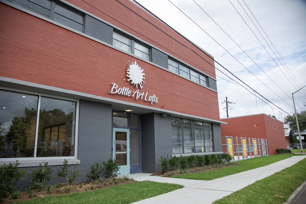 a brick building with a sign that reads