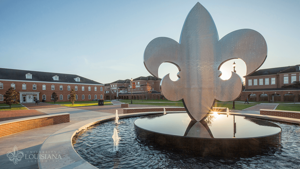 a fountain in front of a building on the campus