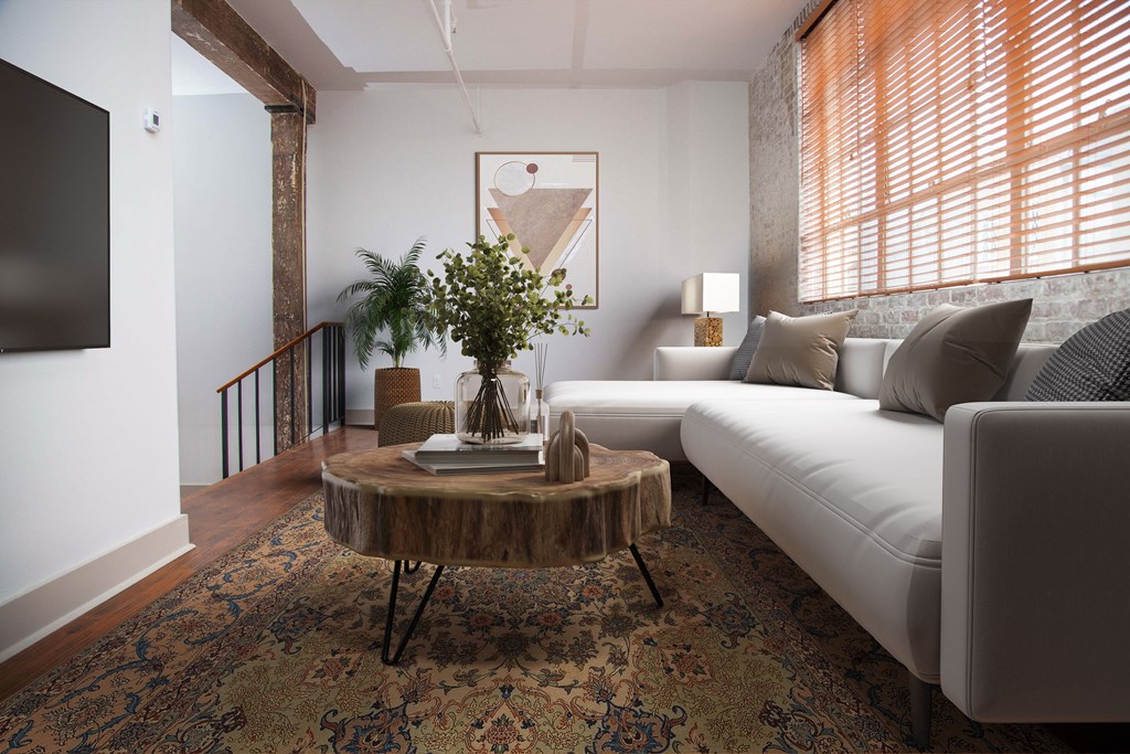 a living room with a white couch and a table