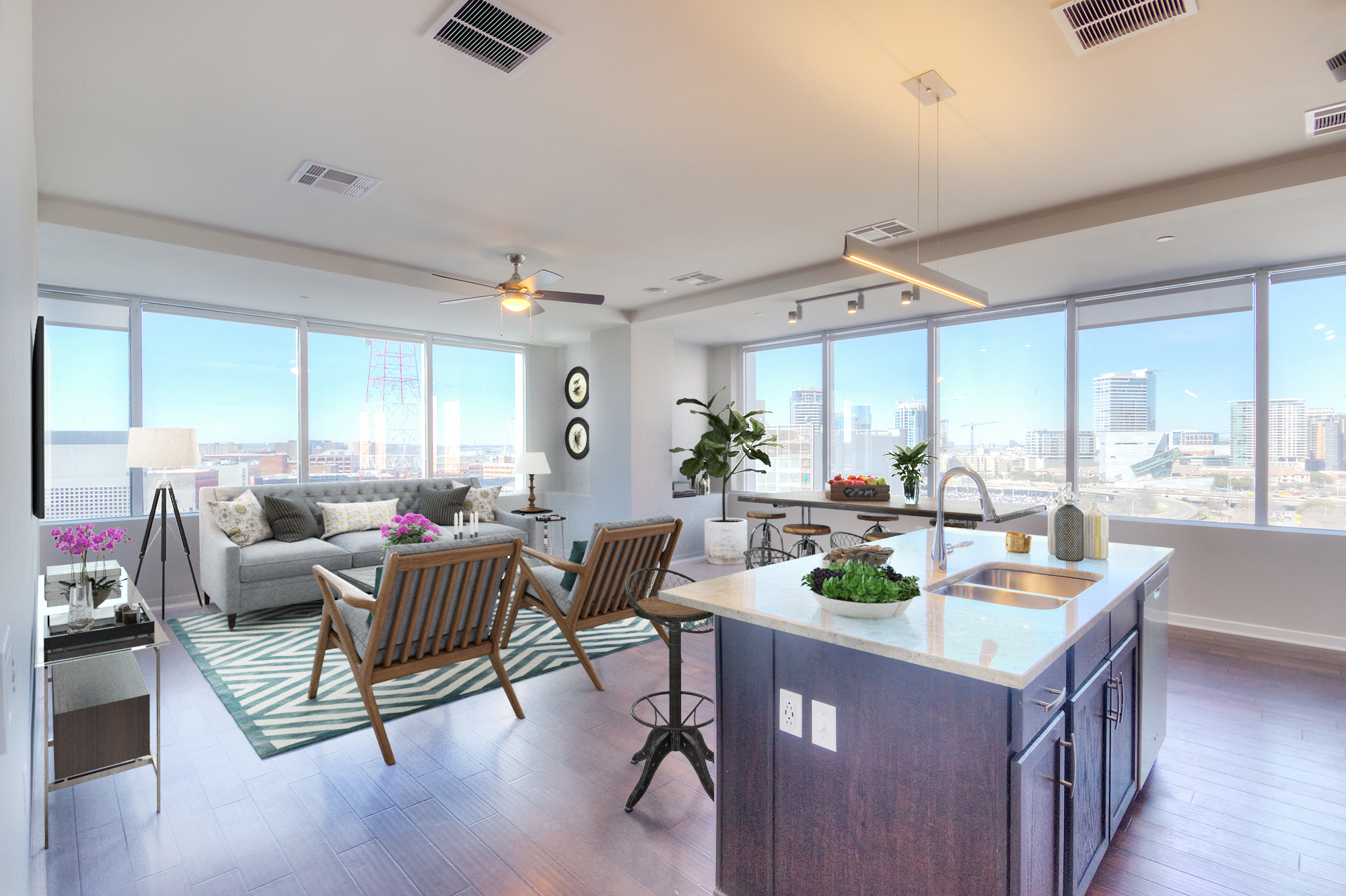 an open living room and kitchen with a view of the city