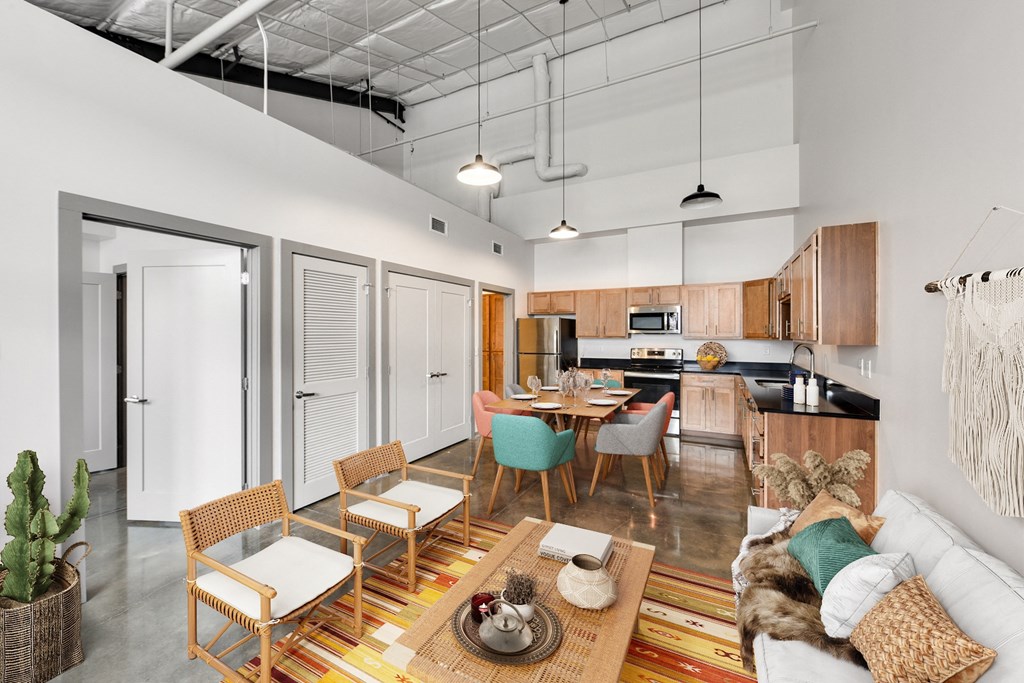a living room with a couch and a table with chairs