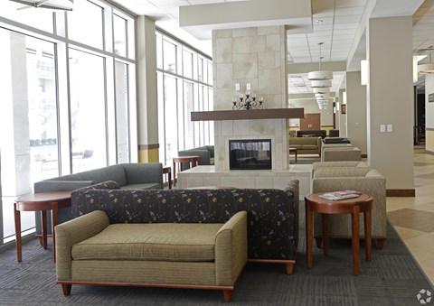 A living room with a fireplace and a couch.