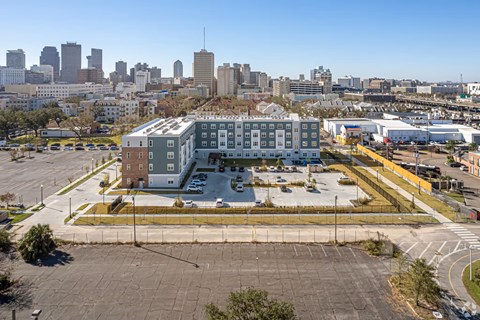 A large building with a parking lot in front of it.