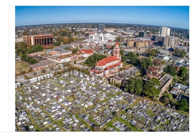 an aerial view of the city with the city hall