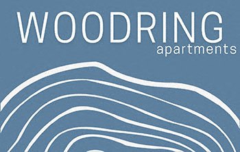 A blue poster with the word "WOODRING" in white at the top and "apartments" in smaller white text below it.