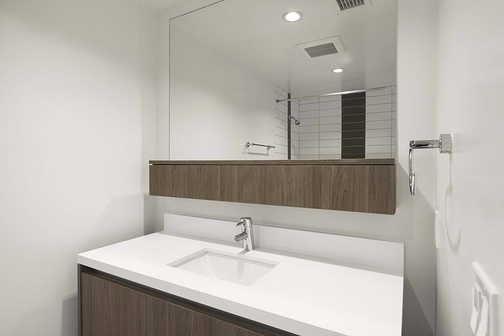 A bathroom sink with a mirror above it.