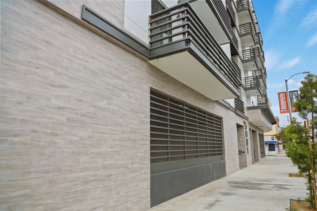 a garage door on the side of an apartment building at The Fairfax Flats Apartments, Los Angeles, CA
