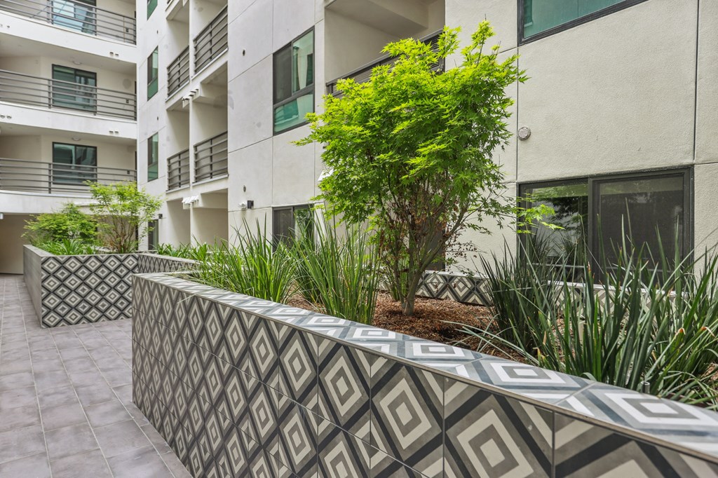 an image of the exterior of an apartment building at The Fairfax Flats Apartments, Los Angeles, CA