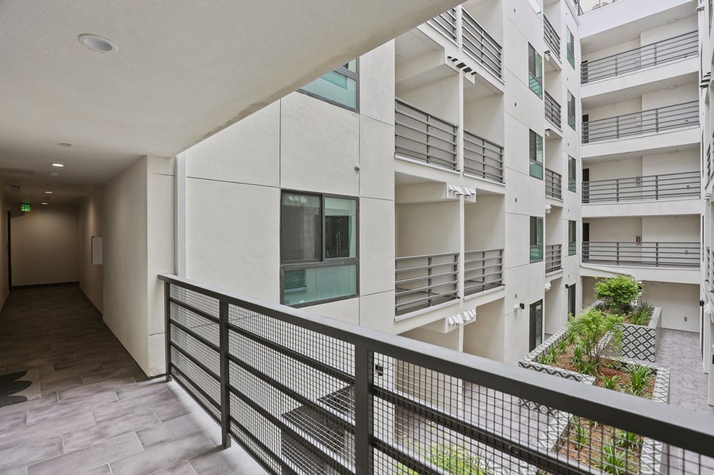 a view of the balconies of an apartment building at The Fairfax Flats Apartments, Los Angeles, CA, 90019
