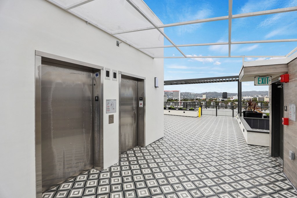 a view of the elevators on the top floor of the building at The Fairfax Flats Apartments, Los Angeles, CA