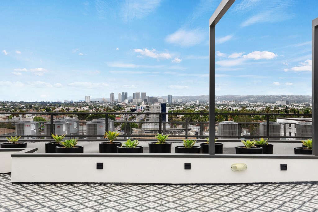 a view of los angeles from a roof top terrace at The Fairfax Flats Apartments, California