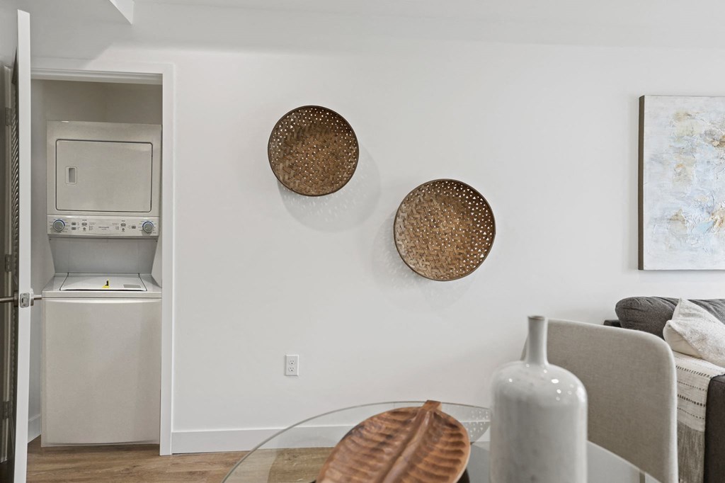 a living area with a glass coffee table and a gray couch at The Fairfax Flats Apartments, Los Angeles, CA, 90019