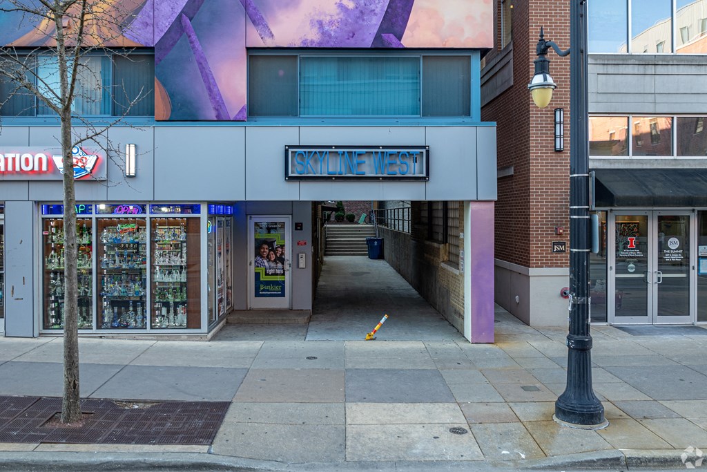 a street view of a building with a ramp in front of it