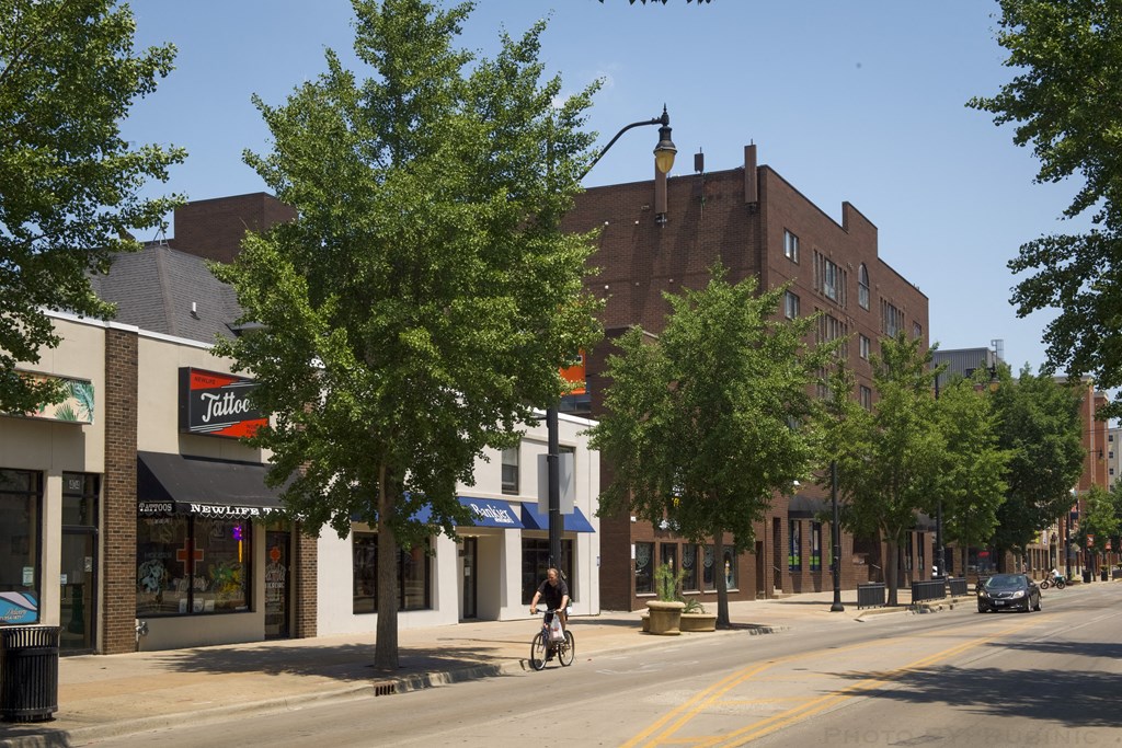 a man riding a bike down a street