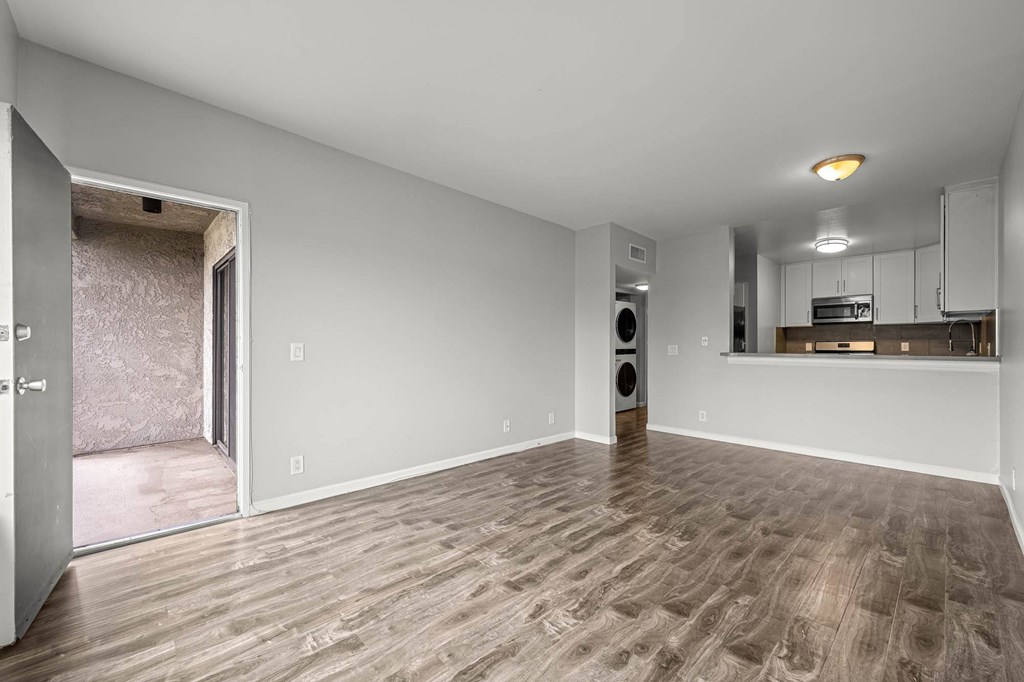 A room with a wooden floor and a speaker in it at Lafayette Apartments, Los Angeles 90019