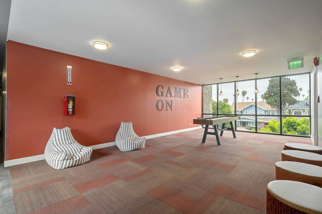 A room with a red wall and a sign at Lafayette Apartments, Los Angeles 90019