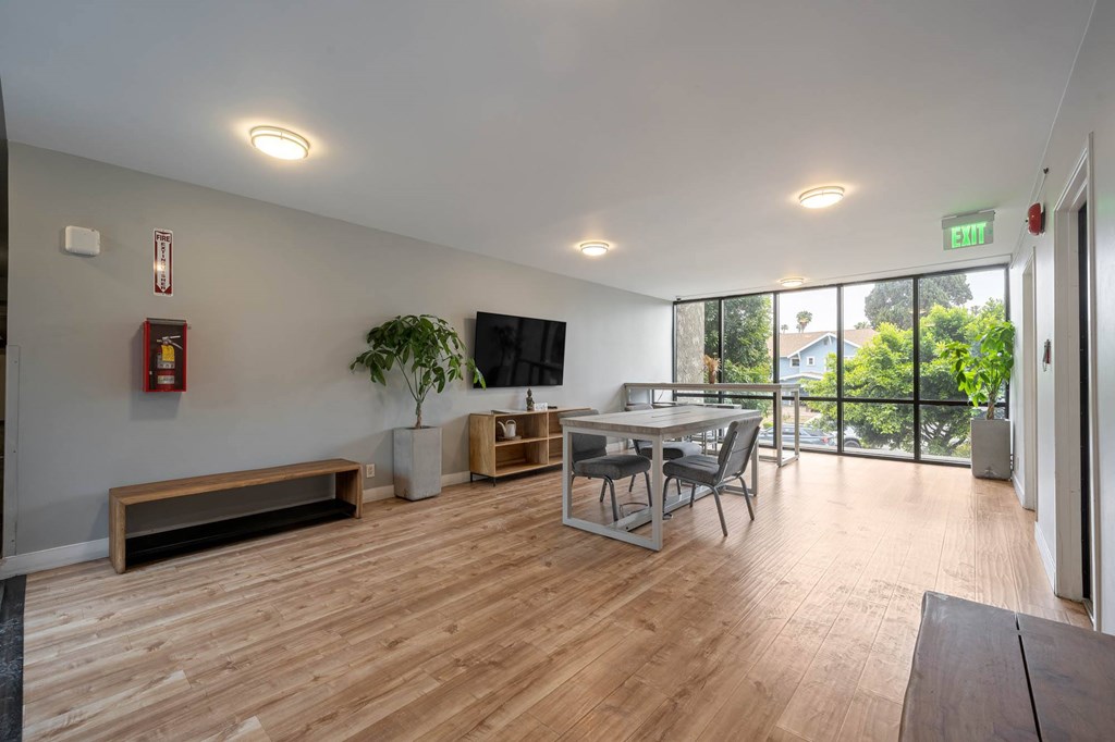 A room with wooden floors and a bench at Lafayette Apartments, Los Angeles, CA, 90019
