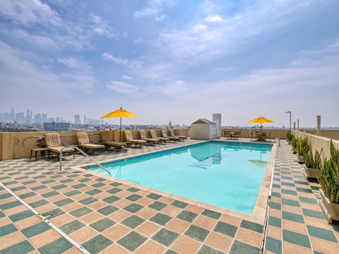 Swimming pool with tiled floor at The Langham Apartments, Los Angeles