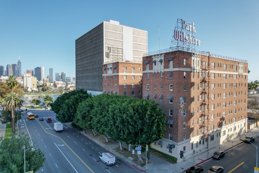 A city street with a building that has a sign that says