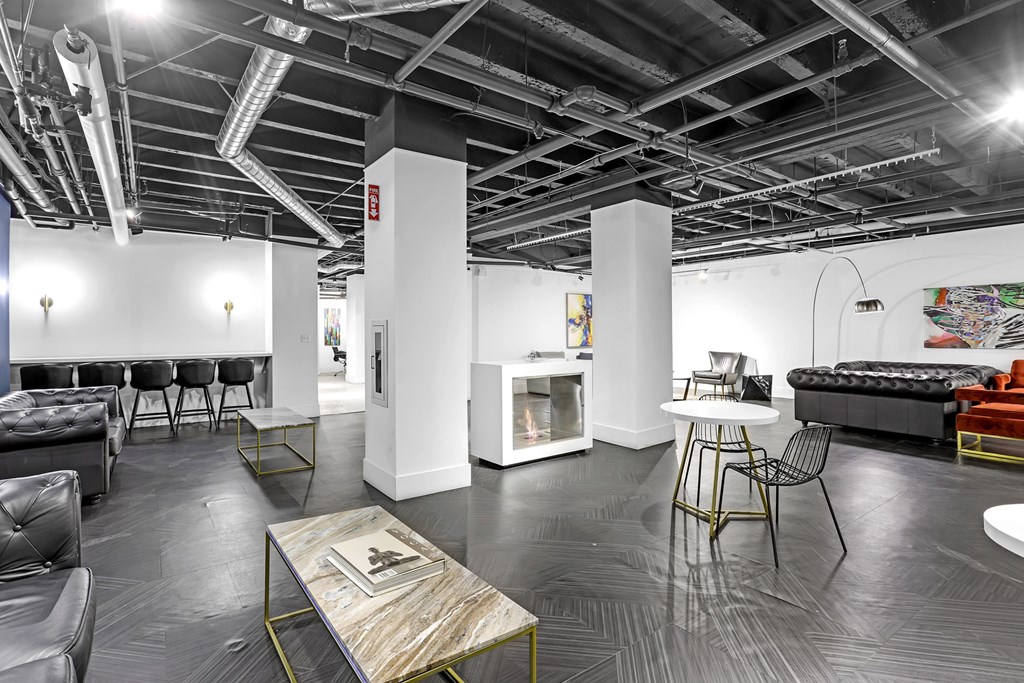 A modern living room with a black and white color scheme.