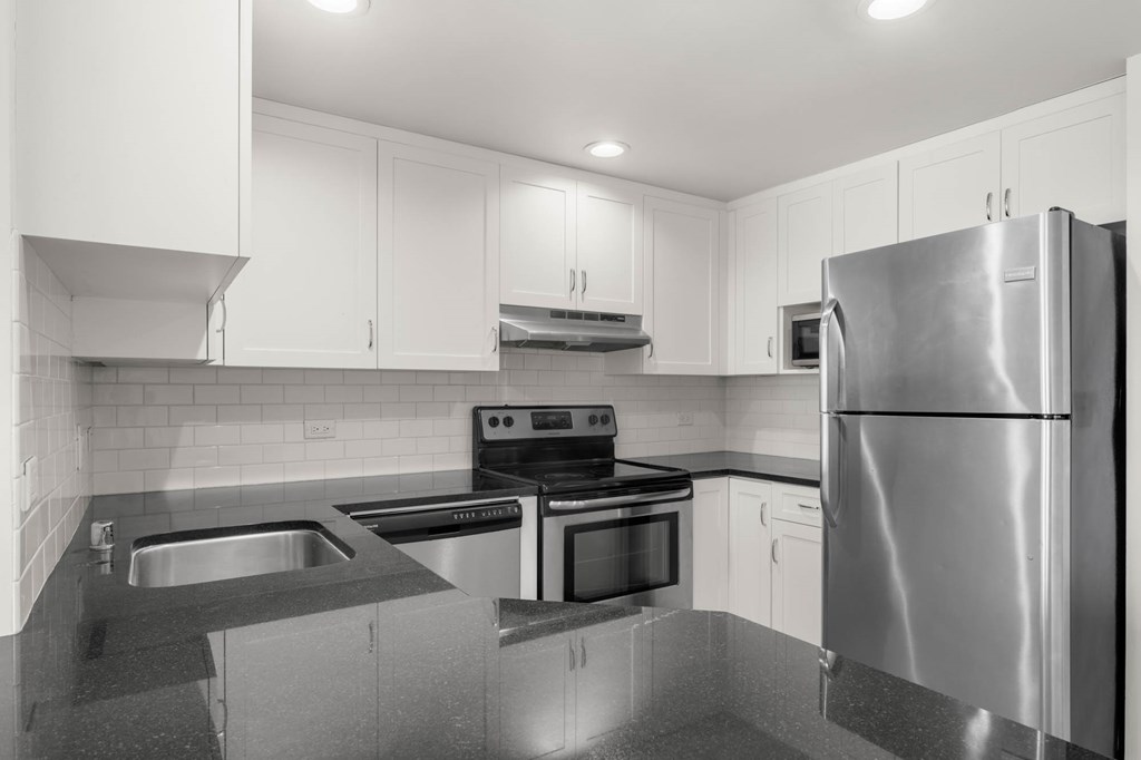 Kitchen with cabinets at Grand Central Market Apartments, Los Angeles, CA, 90013