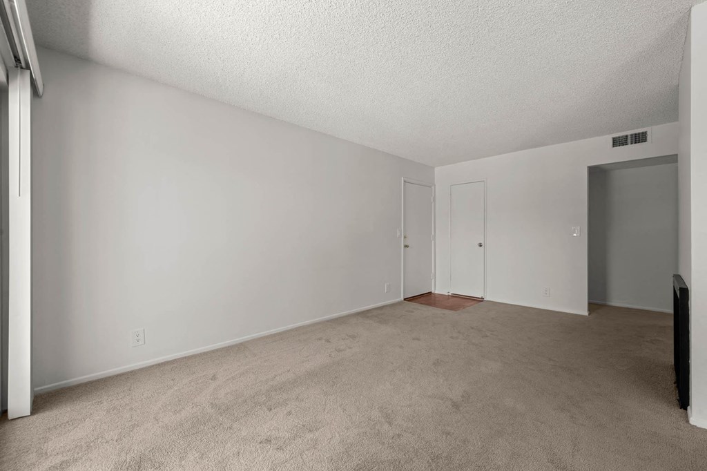 our spacious living room is empty and ready for you to move in