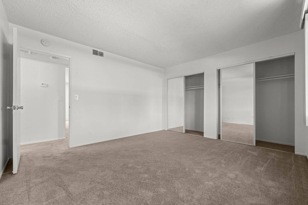 our spacious living room is empty and ready for you to move in