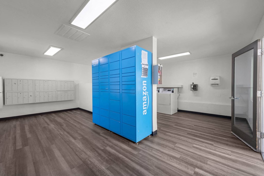 a blue vending machine is in the middle of a room