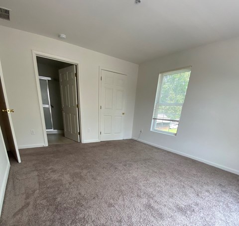 American Square Apartments - 55+ Community - Master Bedroom / Wall-to-wall carpet