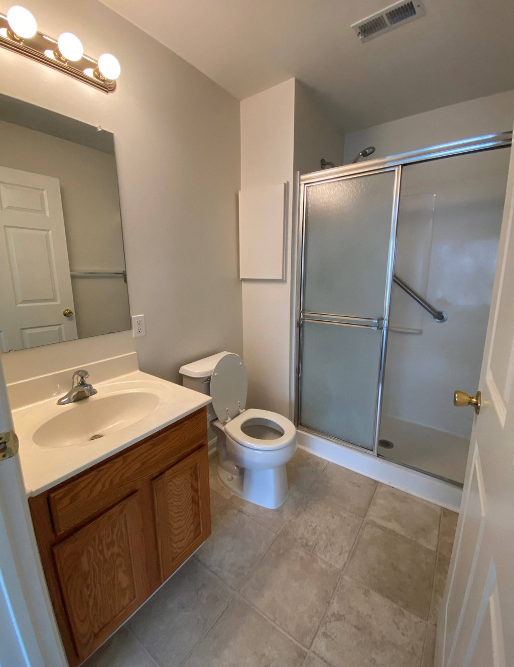 American Square Apartments - 55+ Community - Master Bath / Vanity / Step-in shower / Vinyl flooring