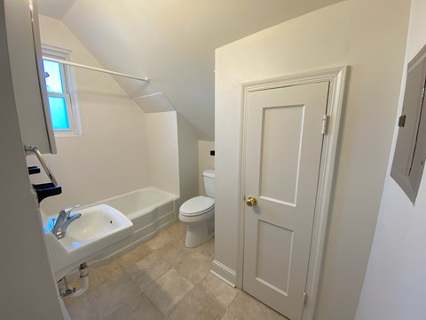 a bathroom with a toilet sink and bathtub
