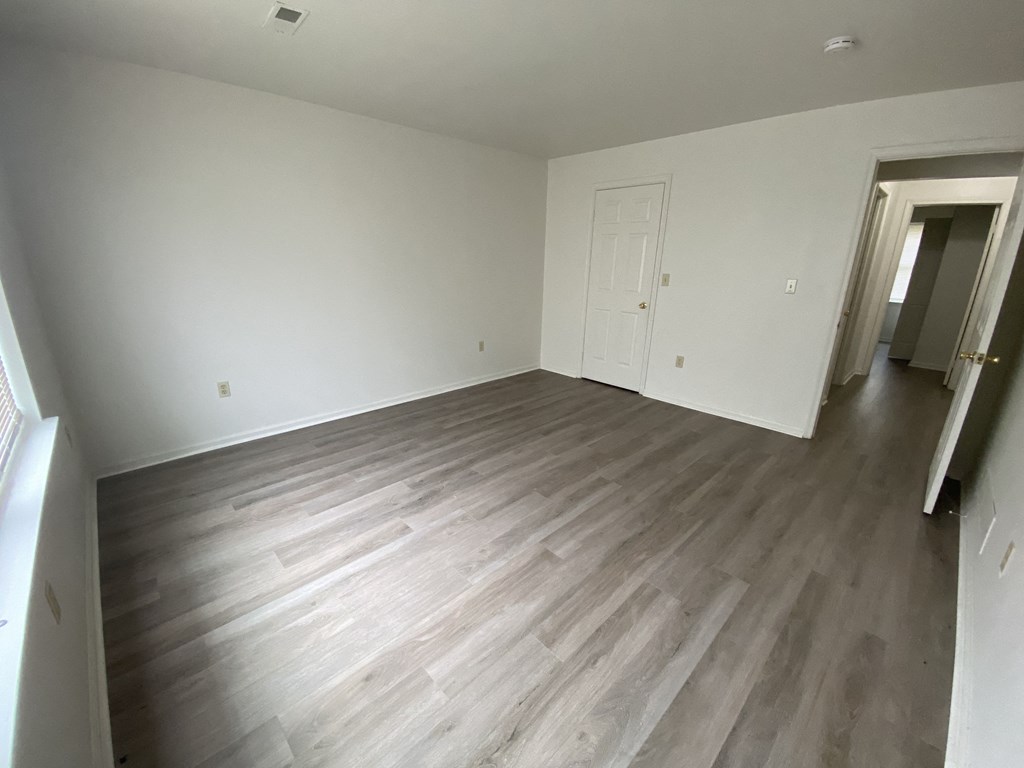 Courtside Apartments - 55+ Community - Bedroom / Wood-grain vinyl plank flooring