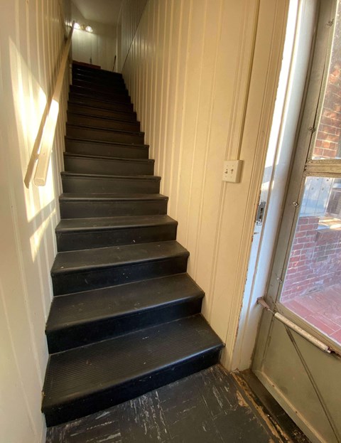 a view of the stairs from the bottom of them