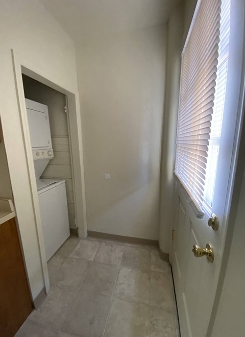 Kings Court Apartments - Front House - Laundry Center (Washer/Dryer) / Vinyl flooring / Exterior door to patio