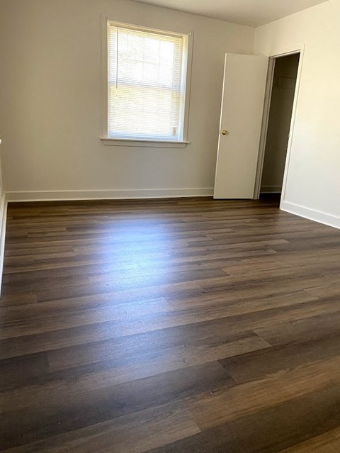 Garden Court Apartments - Bedroom / Wood-grain vinyl plank flooring