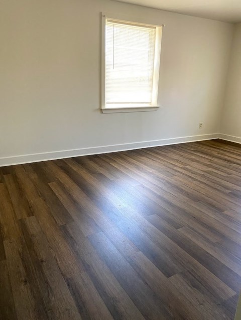 Garden Court Apartments - Bedroom / Wood-grain vinyl plank flooring