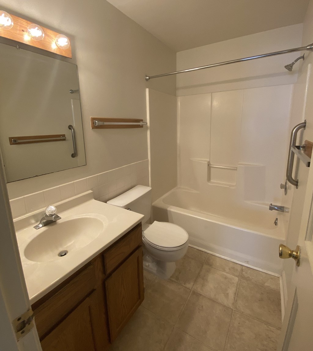 Kings Court Apartments - Main Building - Master Bath / Bathtub / Vanity / Vinyl flooring