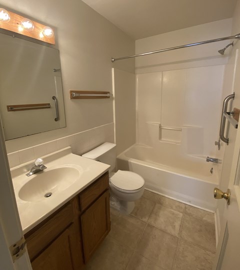 Kings Court Apartments - Main Building - Master Bath / Bathtub / Vanity / Vinyl flooring