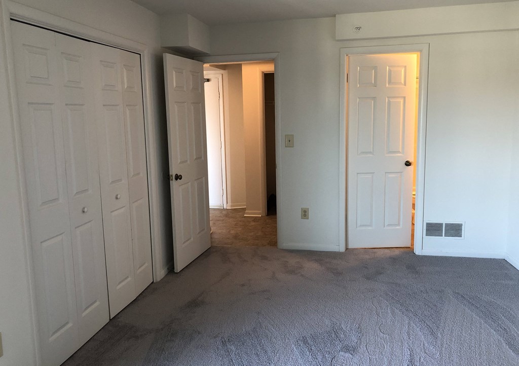 Loockerman Square Apartments - Bedroom with doors to Bathroom & Hallway