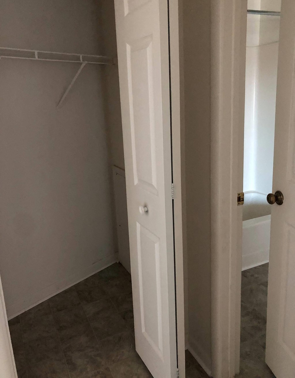 Loockerman Square Apartments - Hallway closet & Hallway door to bathroom.
