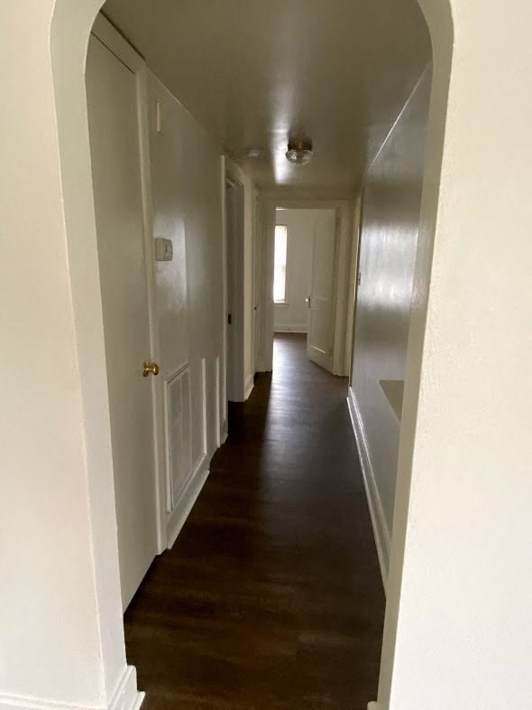 Mitten Apartments - Hallway from Living room to Bedrooms / Arched doorway / Wood-grain, vinyl plank flooring